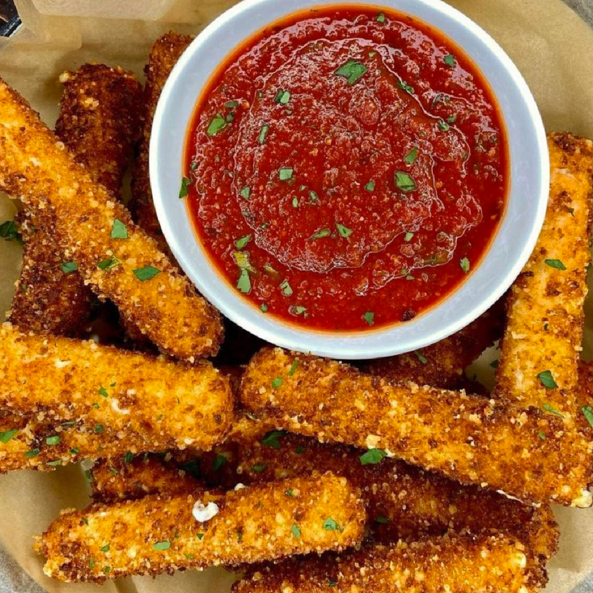 https://johnnysfinefoods.com/cdn/shop/articles/Parmesan_Crusted_Mozzarella_Sticks-1200_1200x1200.jpg?v=1682012970